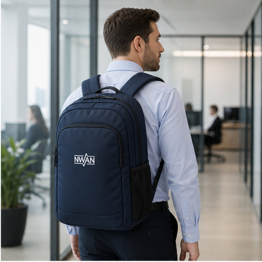 Corporate commuter wearing navy backpack with NWAN logo