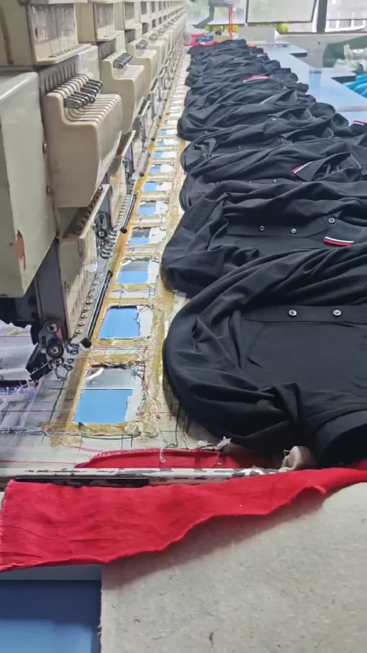 Polo shirts being embroidered on a production line for a NWAN order
