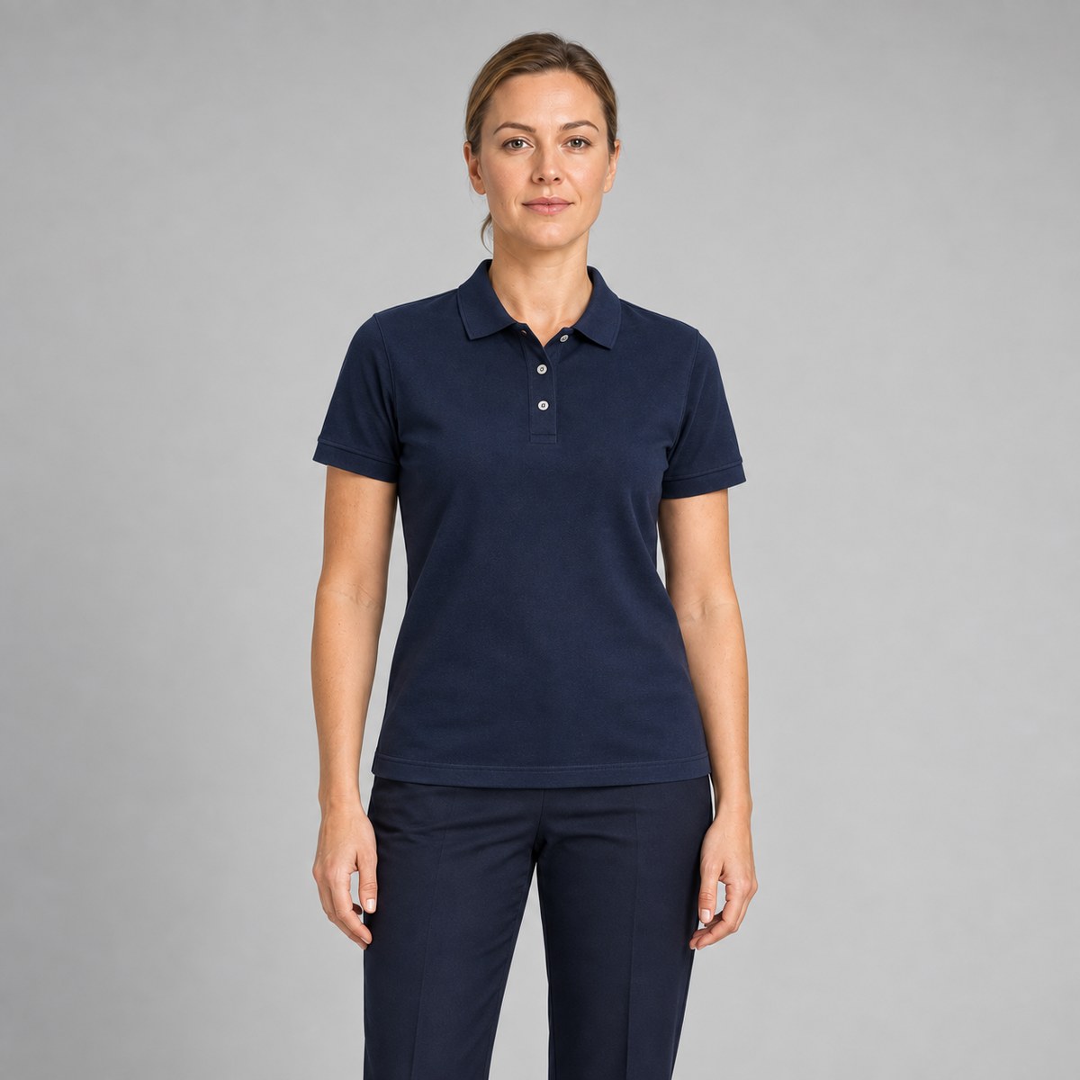 Woman wearing a navy custom cotton pique corporate polo shirt
